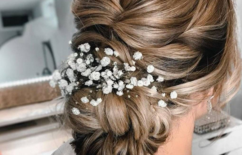 A woman's hair styled for a wedding