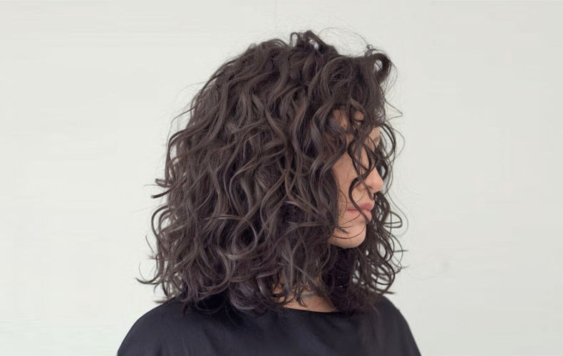 A woman with beautifully-permed hair